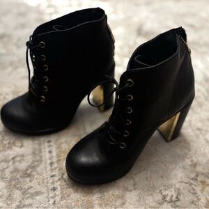 Torrid Black and Gold Heeled Boots